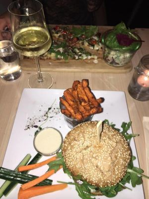 The Souls Burger, sweet potato fries w/ dip. Farthest away: the Pizza with a side salad at Souls in Copenhagen