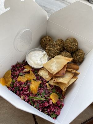 Go here!!!! Falafelbox with great sauce and chips. Super cheap and amazing food.  at FalafeLand in Santorini