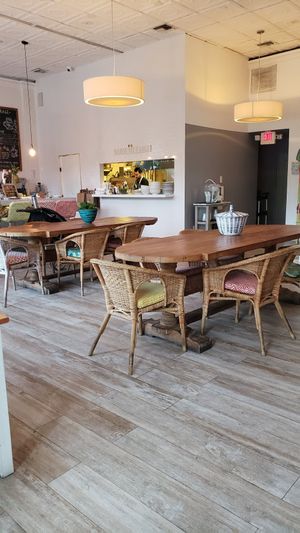 Great community tables or bring your friends. Comfy chairs at Lilikoi Organic Living in Miami Beach