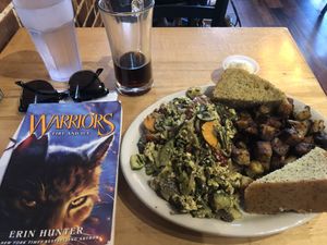 Vegan Queen Anne scramble, with added pickled veggies and home fries. The vegan pesto really makes this dish, and the lemon poppy bread was great!  at Crow's Nest in Kalamazoo