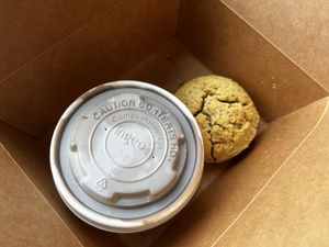 biscuits and gravy with one biscuit that was raw in the center and crumbled, served in a to-go box for dine in  at Gluten Free Gem in Portland