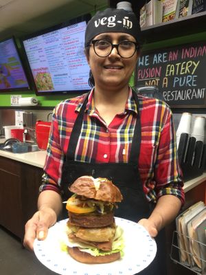 Brooklyn Double Decker. This 8” high burger has Beyond Meat patty and jumbo samosas tucked in Pretzel bun with our proprietary sauces & veggies. It is also available as gluten-fr at Veg-In YYC Re-Planted in Calgary