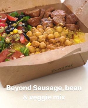 AJ Ellison fitness trainer from USA enjoyed a special High Protein Bowl made with Beyond Sausage, Chickpeas, Beans and Veggies at Veg-In YYC Re-Planted in Calgary
