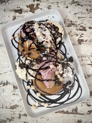 Sharing Dessert. This wasn’t on the menu, we just asked for a dessert to share. It had donuts, ice cream, cream marshmallows, chocolate sauce and Oreos at Voltaire in Bangor