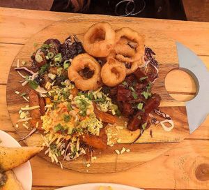Onion rings, cauliflower wings, dirty sweet potato fries and bbq ribs at Voltaire in Bangor
