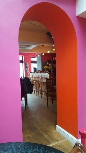 arch between glassed eating area and main room at Voltaire in Bangor