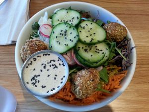 K&K Paleo (roasted yam, baked hemp and sunflower balls, sauerkraut, fennel slaw, cucumber, arugula, kale, purple cabbage, sprouts, carrots, and sesame seeds with lemon tahini sauce and horseradish chimichurri). at Kupfert & Kim - Spadina in Toronto