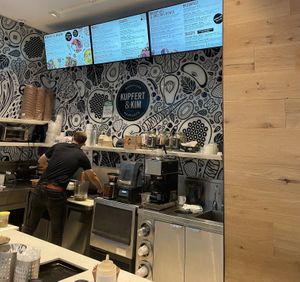 When you enter the building, take the escalator up one to the second floor  at Kupfert & Kim - Waterpark Place in Toronto