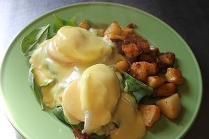 Eggs Florentine, english muffin, baby spinach, tomato, poached eggs and home made hollandaise sauce.  at Ralph's Cafe in Brooks