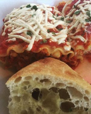 Homemade lasagna and ciabatta bread at Paisley Vegan Kitchen in Cocoa