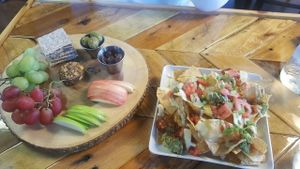 cashew cheese board & pile high nachos at Paisley Vegan Kitchen in Cocoa