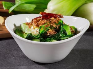 Bok choy stir-fried with garlic, dried chilies, and crunchy shallots at Yugo in Miami