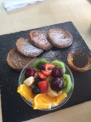 Vegan pancakes served with agave and fruit salad, Will order without sugar next time, a bit overload with the sugars. at Cafe Nomad in Fuengirola