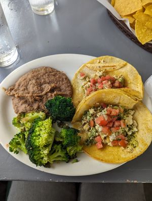 Tofu chimichurri tacos without queso fresco and with refried beans and broccoli at Elmyriachi in Atlanta