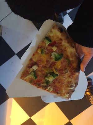 pizza with vegan cheese, tofu and broccoli at Vege Pizza in Poznan