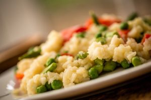 Arborio rice is seasoned with minced onions and garlic and slow cooked with homemade vegetable stock, topped with flash steamed vegetables. at Fred and Ricky's Plant Delicious Foods - Westport in Maryland Heights