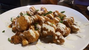 Vegan cauliflower bites with vegan ranch!!! These were delicious! at Mozzarella Fellas in Winston-salem