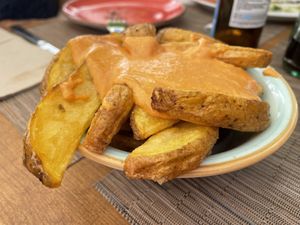 2nd patatas bravas after claiming the hair  at La Tabla De Sitges in Sitges