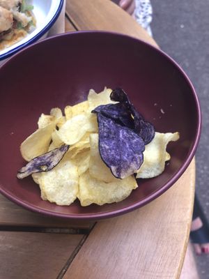 Burgers come with a side of assorted crisps    at Caju in Nice