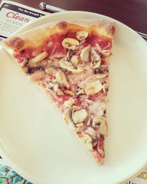 The pizza slices are huge! at Mario's Pizza in Ocean City