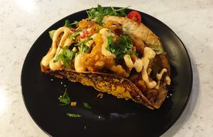 Taco filled with fried oyster mushrooms and minced tofu at Zielona in Lodz