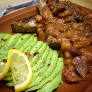 Cowboy style beans on sunflower & molasses wholemeal bread, with a side of avocado. at Idle Hands in Manchester