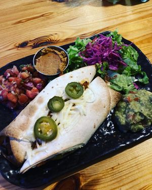 Vegan Enchiladas with spicy bean dip! Love it!! at Beats & Burritos in Lagos