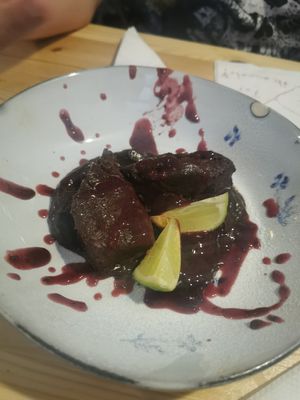 Chocolate brownie with chocolate sauce and berry sauce (vegan) at Beats & Burritos in Lagos