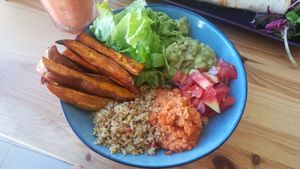 Yummy Hummus bowl : roasted sweet potatoes, lettuce, guacamole, hummus 1, tomatoes, hummus 2, quinoa. at Beats & Burritos in Lagos