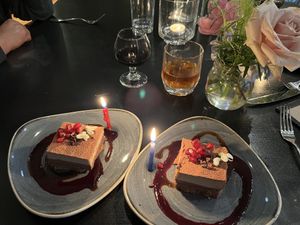 Raw tiramisu, port, and tea with candles & flowers  at Harvest Beat in Seattle