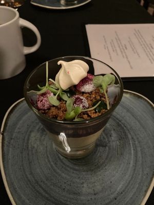 Luxury sugar pie pumpkin mousse with saffron spice meringue, graham cracker crumble, and wild foraged huckleberry at Harvest Beat in Seattle