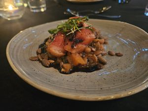 Grilled watermelon over blackeye peas and collard greens at Harvest Beat in Seattle