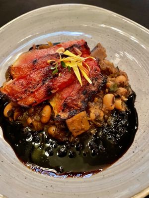 Marinated grilled watermelon with smoked celery root "pancetta", black eyea peas and collard greens  at Harvest Beat in Seattle