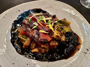 Marinated grilled watermelon with smoked celery root "pancetta", black eyea peas and collard greens   at Harvest Beat in Seattle