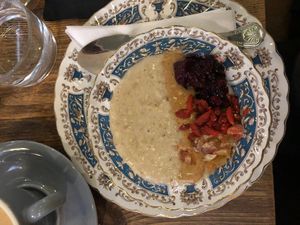 Vegan porridge with homemade nut butter, fruit compote and dried fruit. at Mrs Atha's in Leeds