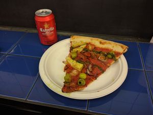 Queen Vegan Pizza [£4.00] – Artichoke Hearts, Green Olives, Red Onion, Sun-Blush Tomatoes, Tomato Sauce, Green Sauce; Can of Estrella Damn [£4.50]  at Voodoo Rays - Boxpark in East London