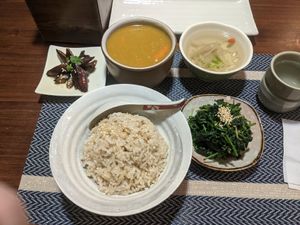 Entree of curry with sides of soup, greens, and eggplant. at Hsia An Chu Vegetarian in Taitung