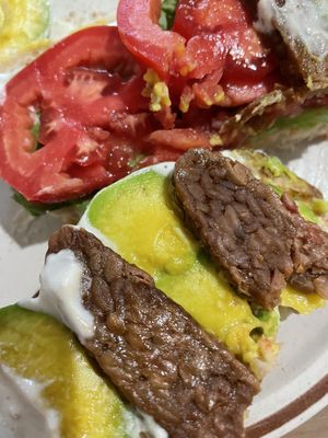 Generous amount of avo and tomato and tempeh  at La Studio in Hanoi