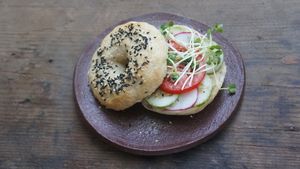 hummus sandwich with cucumber, tomato, sprouts on a homemade bagel at La Studio in Hanoi