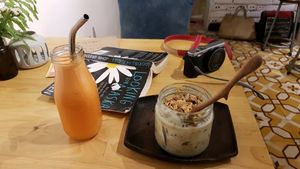 Granola and orange/carrot juice. at La Studio in Hanoi