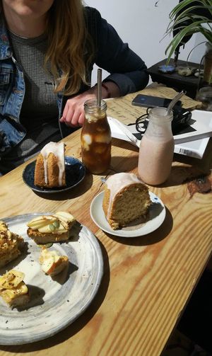 Lemon coconut cake, fruit toast, coconut coffee and strawberry milkshake.  at La Studio in Hanoi