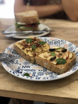 Cacao Bana smoothie bowl, Peanut Butter toast and Tempeh toast. Delicious. at La Studio in Hanoi