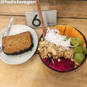 Carrot sesame cake and yellow tango smt bowl at La Studio in Hanoi