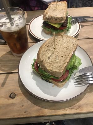 Cold brew and two smoked tempeh sandwiches with wholewheat bread  at La Studio in Hanoi