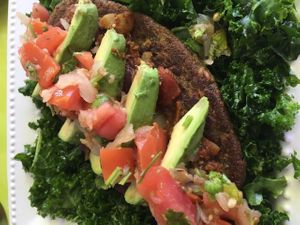 Mex Veggie Burger Special 
burger over marinated kale with chili, pico, and avocado. HUGE.  at Eat the Tea in Fort Lauderdale