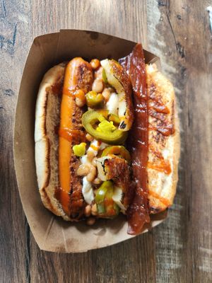 *vegan* Blazing Saddles: Cream Cheese, Baked Beans, Thai Chilies, Grilled Pineapple, Caramelized Brown Sugar, Bacon, Sriracha. at Lucky Louie's Beer and Wieners in Erie