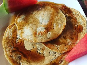 Vegan pancakes with agave type syrup at Nakum in Flores