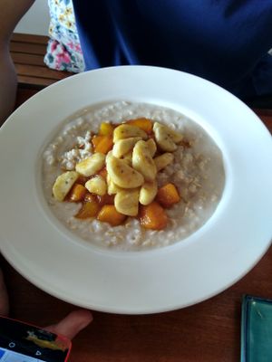 Coconut oatmeal with caramelized fruit at Simple Things in Kampot