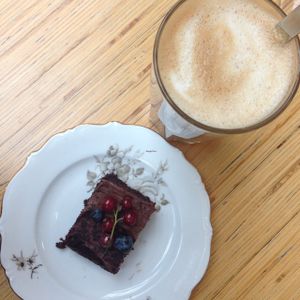 latte with oat milk and vegan chocolate cake at Cafe Köket in Helsinki