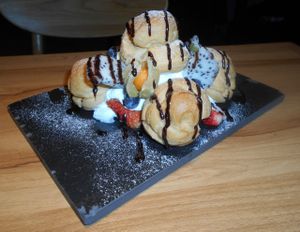 Cream Profiteroles w. Chocolate & Fruit $48HKD > a real treat for the taste buds!!! at So Thai So Good  in Kowloon